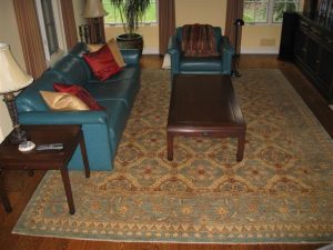 Place the rug on top of the padding