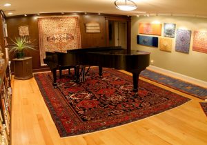 Antique Heriz rugs and piano on top