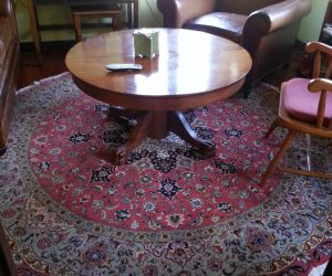 Round Tabriz Rug Under A Round Table