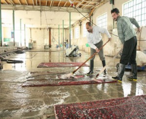 washing persian rug with water and soup